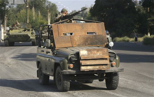Weapons convoys seen rolling in eastern Ukraine