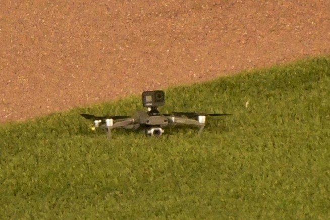 Drone lands in outfield at Wrigley Field, causing delay