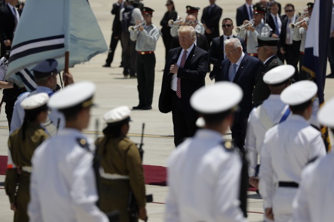 The Latest: Trump begins Israeli visit with levity