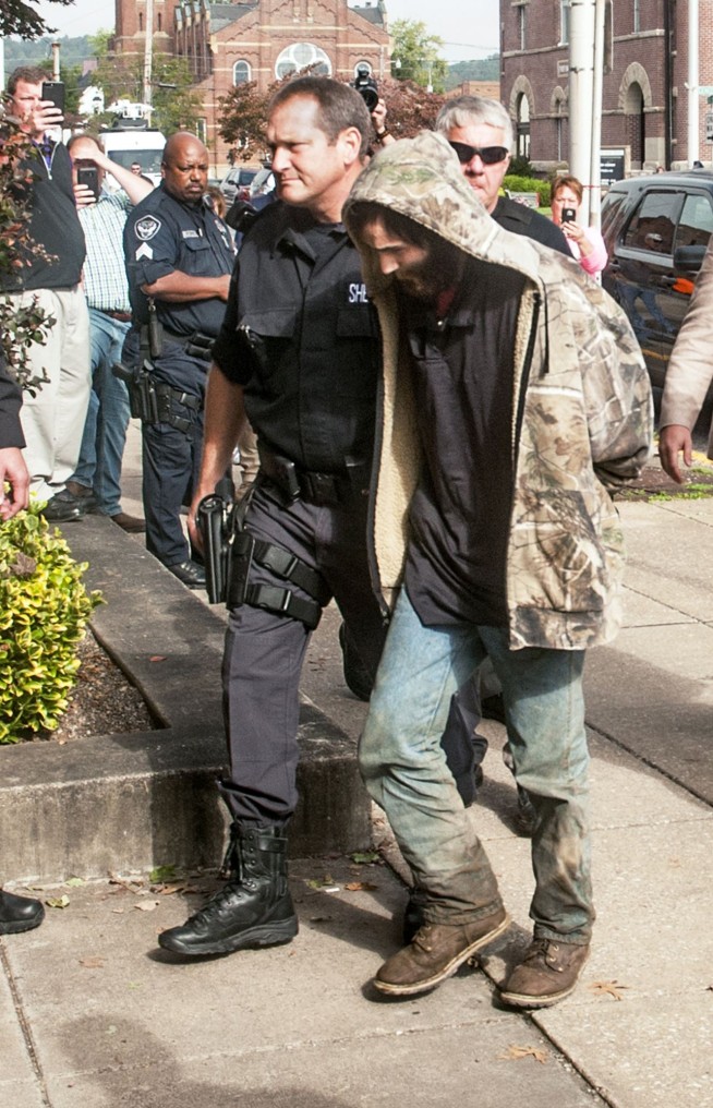 The Latest: Sheriff IDs 3 slain adults, suspect arrested