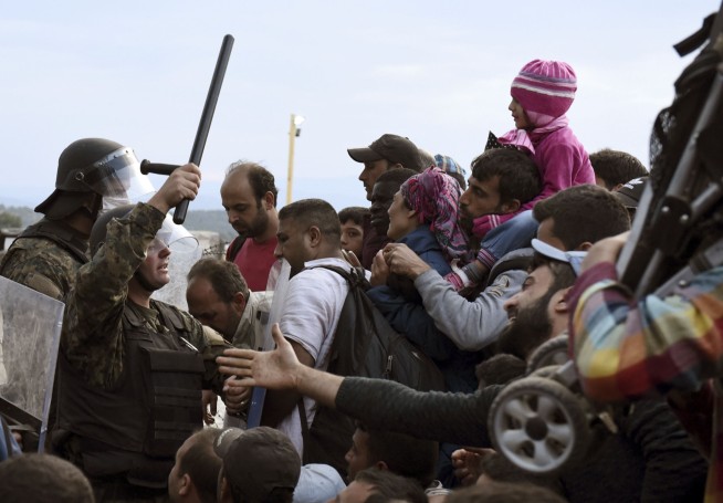 The Latest: Spanish police put down migrant protest