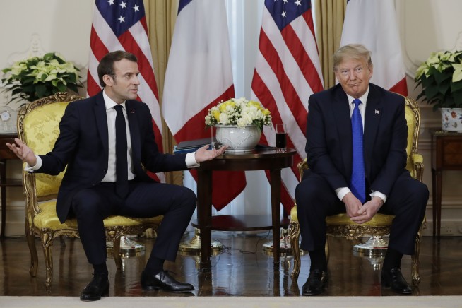 Trump barrels into NATO summit, clashes with France's Macron