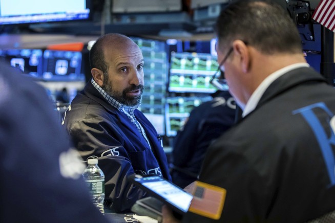 Stocks end mixed after another wobbly day on Wall Street