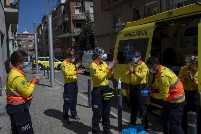 The Latest: Spain reports rise in daily virus cases, deaths