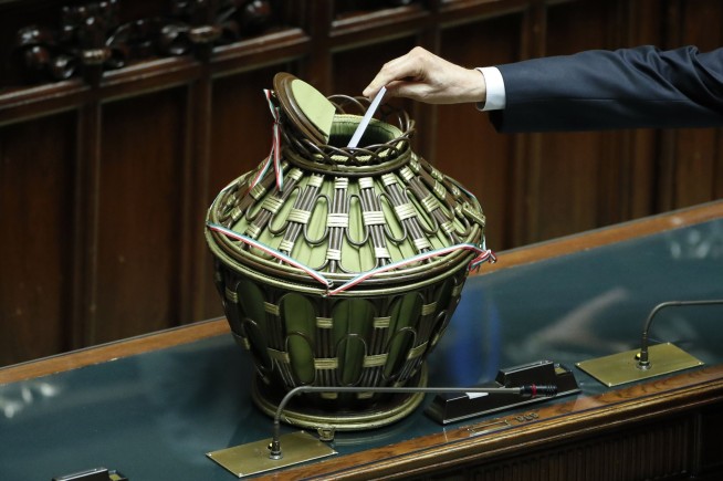 Italy's president, 80, is recruited to stay on for 2nd term