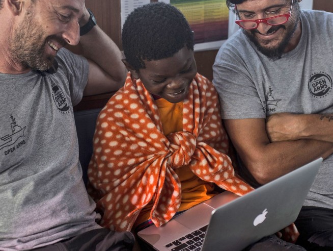 The Latest: Columbus statue protest over migrant deaths