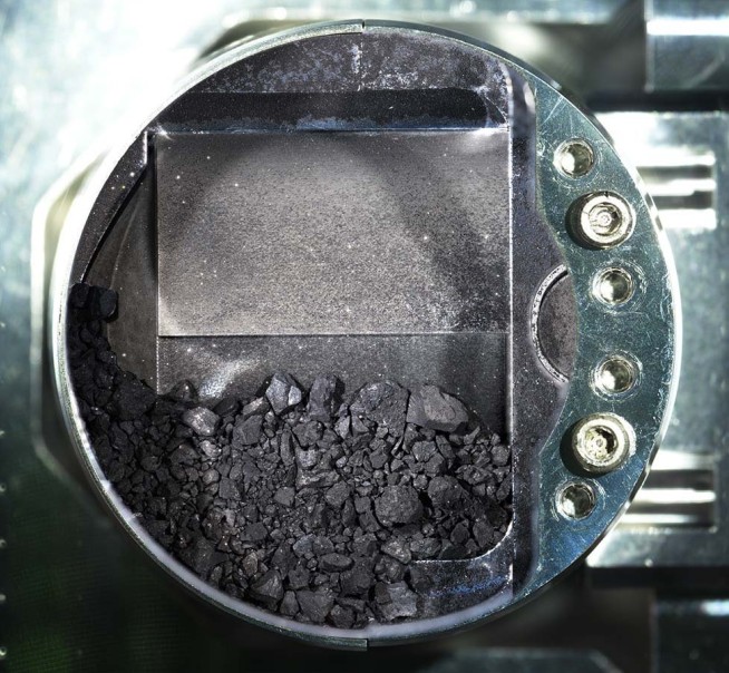 Japanese spacecraft's gifts: Asteroid chips like charcoal