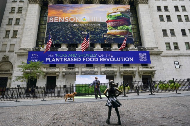 Stocks tick further into record heights on Wall Street