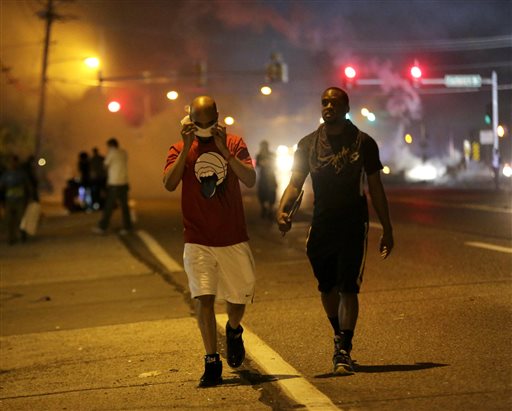 Police, protesters collide again in Ferguson