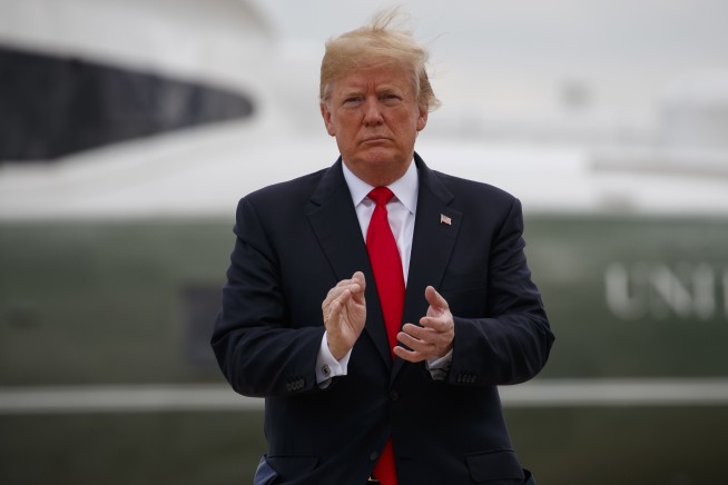 Trump lauds NFL policy banning kneeling for national anthem