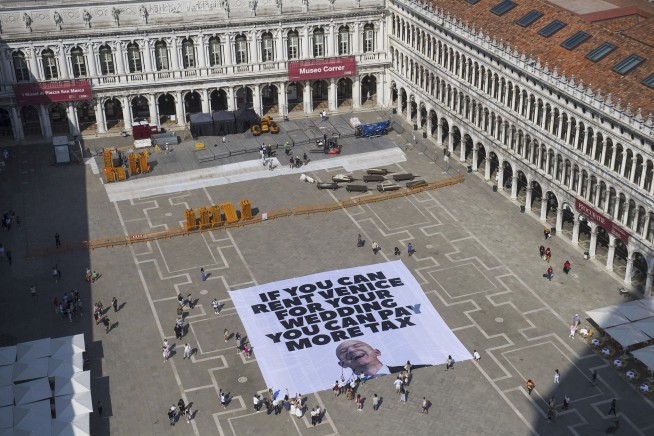 Greenpeace joins anti-Bezos protest with Venice banner complaining about billionaire tax breaks