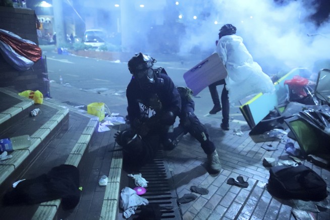 Hong Kong police storm university held by protesters