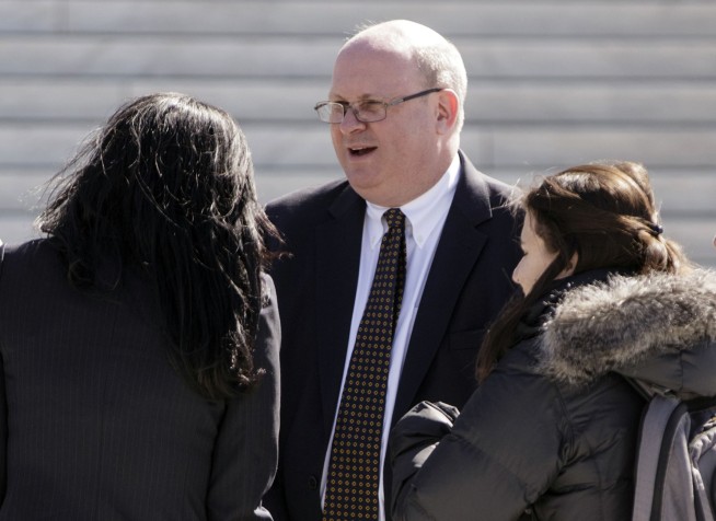 AP source: Clinton camp helped fund Trump dossier research