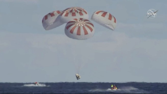 SpaceX crew capsule ends test flight with ocean splashdown