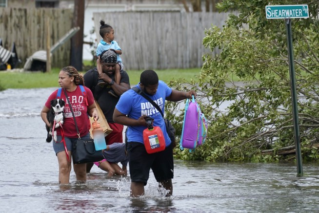 New Orleans levees pass Ida's test while some suburbs flood