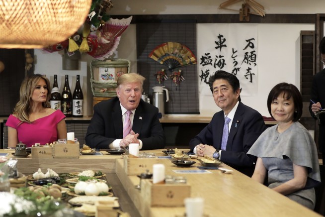 Sumo diplomacy: Abe courts Trump with burgers, golf, more