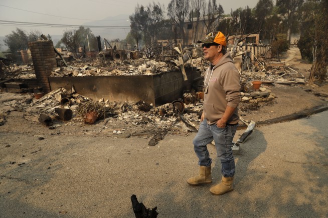 The Latest: Death toll from N. California fire rises to 23