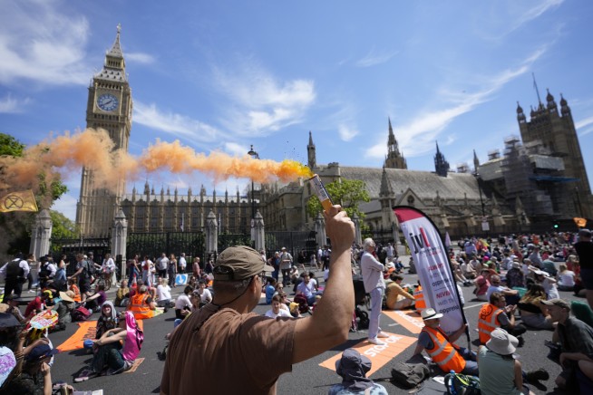 Protesters in UK decry climate change after record heat wave