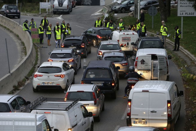 1 dead, dozens injured in French fuel taxes protests