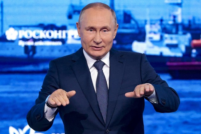 Putin mocks West, says Russia will press on in Ukraine