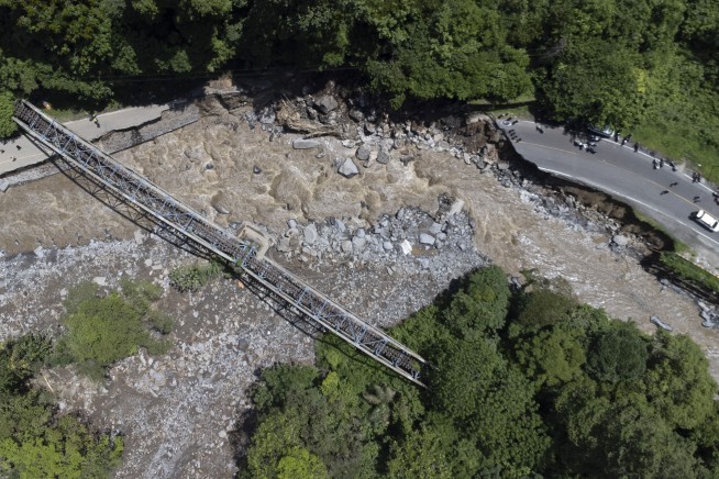 Flash floods and cold lava flow hit Indonesia’s Sumatra island. At least 37 people were killed