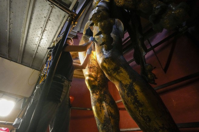 Vatican experts uncovering gilded glory of Hercules statue struck by lightning