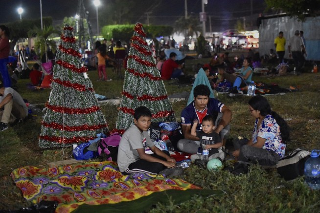 Migrant caravan in southern Mexico marks Christmas Day by trudging onward