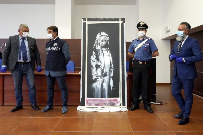 Stolen Banksy honoring Bataclan victims found in Italy
