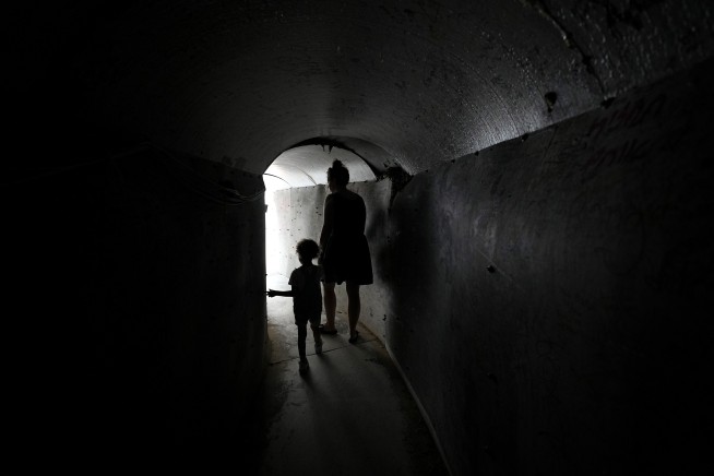 An Israeli airstrike kills 18 members of a family in Gaza as mediators hope for a cease-fire