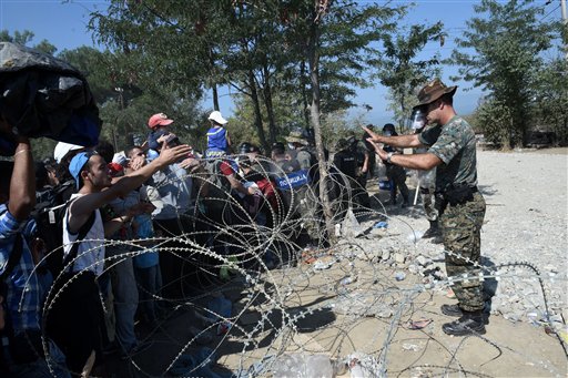 The Latest: Greek ferries carry 4,000 migrants to mainland