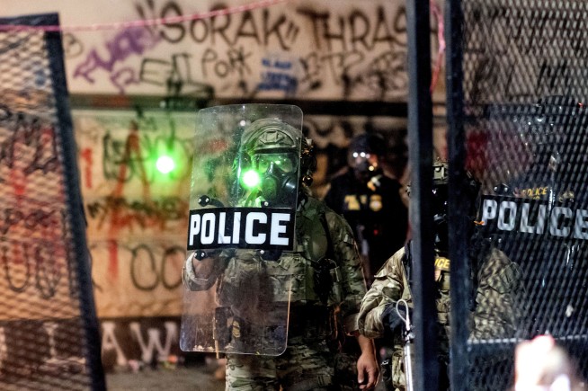 Federal agents use tear gas to clear Portland protest
