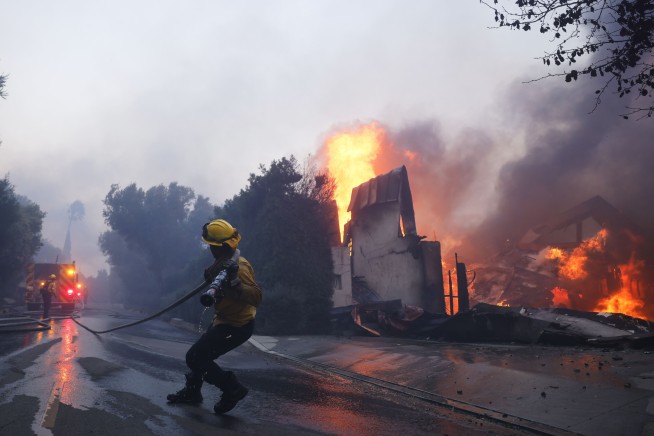California governor says Pacific Palisades wildfire has destroyed many structures as winds kick up