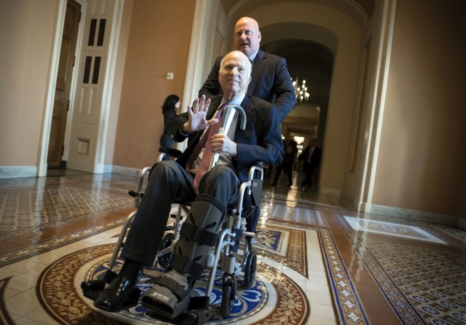 Sen. John McCain's family cries over flag-draped casket