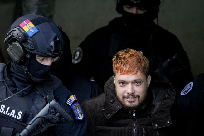 After 9 months on the run, a French fugitive who staged a deadly escape faced court in Romania