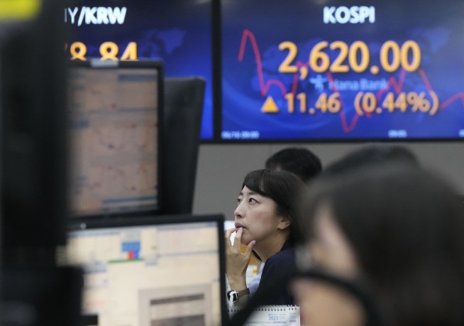 Stock market today: Asian shares track Wall Street rally, Bank of Japan stands pat