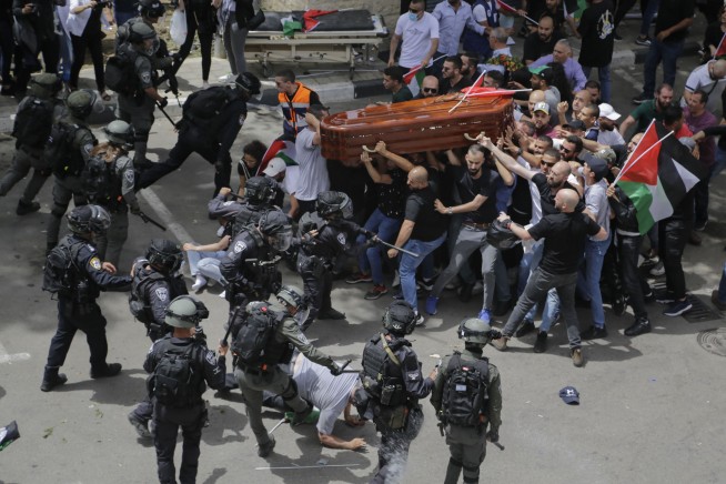 Israel police to investigate conduct at journalist funeral