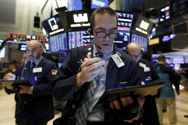 Stocks fall on Apple revenue warning; Dow drops 165