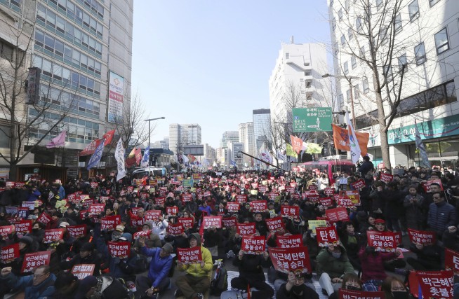 The Latest: Police say 2 dead in S. Korean protests