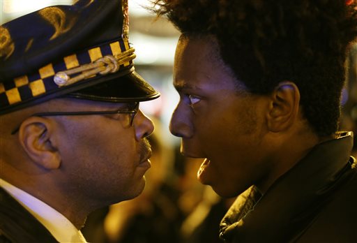 The Latest: Chicago protest groups take different approaches