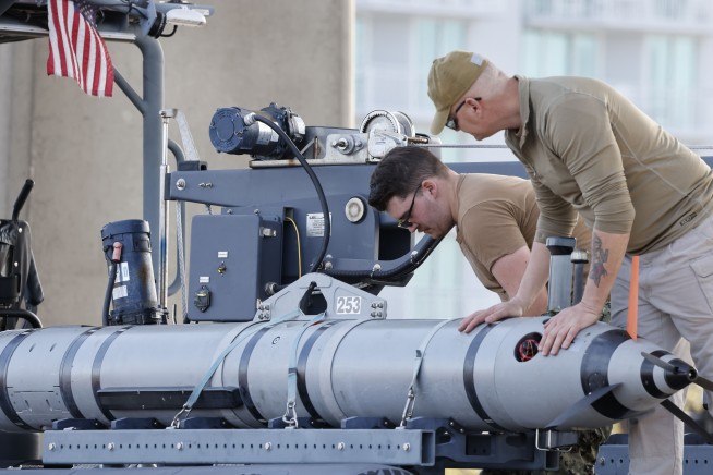 Navy divers begin pulling up Chinese spy balloon debris