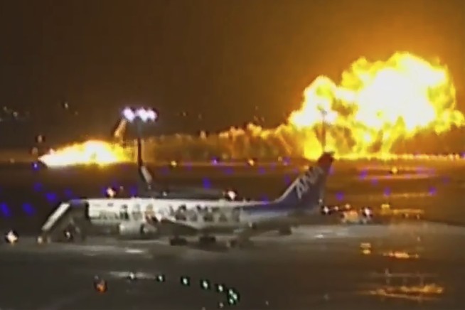 Planes collide and catch fire at Japan's busy Haneda airport, killing 5. Hundreds evacuated safely