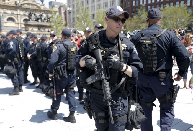 The Latest: Police: About a dozen in custody after protests