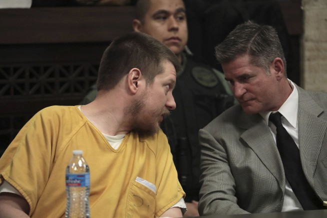 The Latest: Van Dyke barely reacts to prison sentence