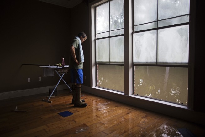 Staying ahead of the mold, residents salvage what they can