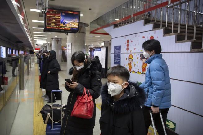 China building a hospital to treat virus, expands lockdowns