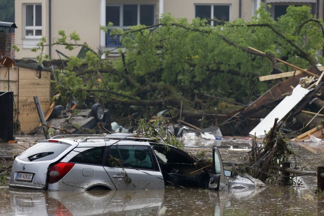 The Latest: Louvre to shut down, move art to higher floors