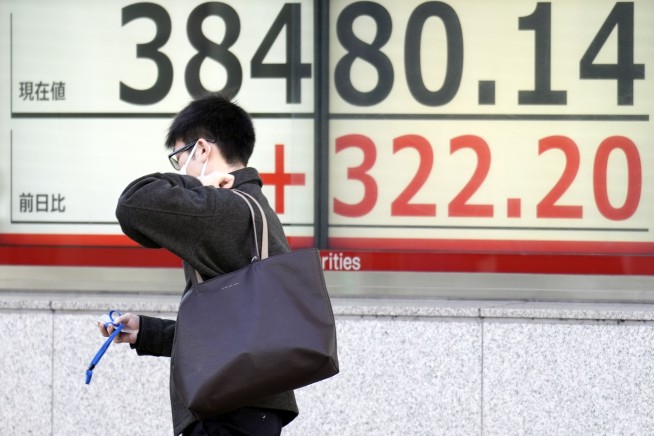 Stock market today: Asian shares track Wall Street rally as Japan's Nikkei nears a record high