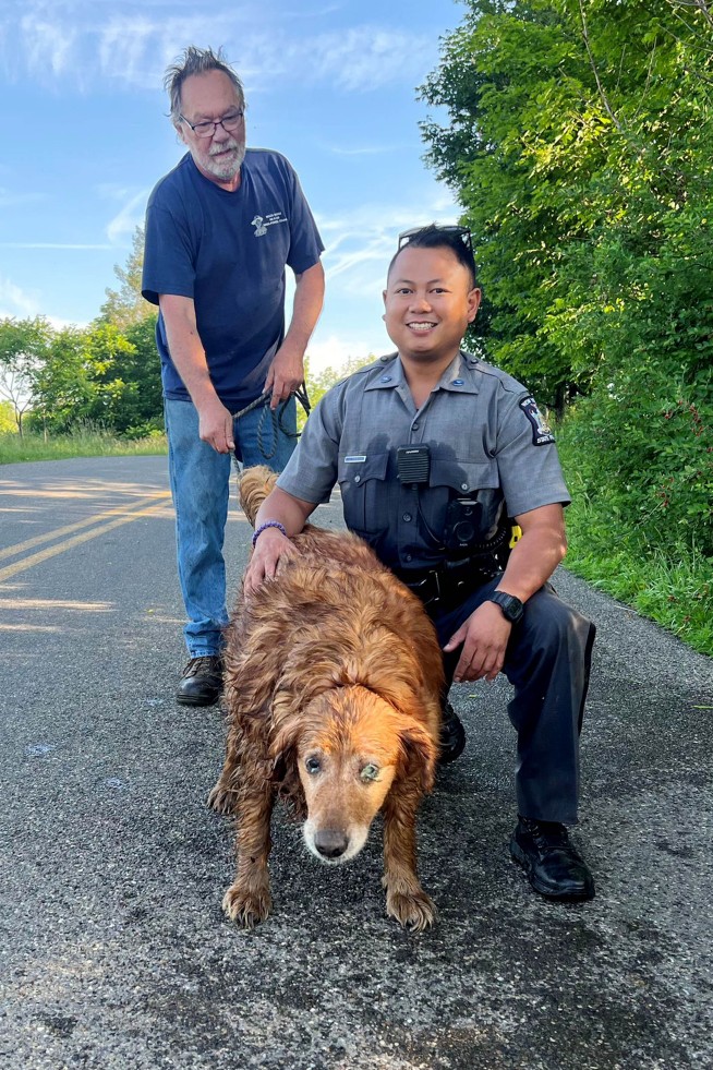 Trooper crawls into drainage pipe to rescue missing dog