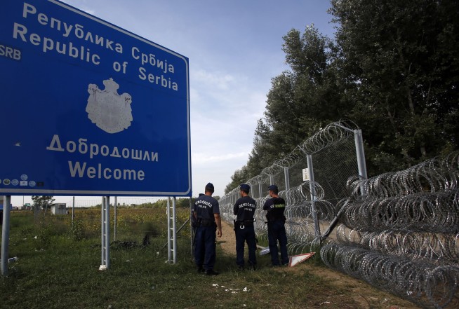 The Latest: Hungary detains 60 migrants under new laws