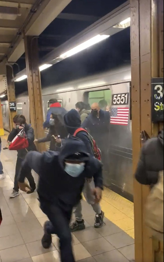 Police hunt gunman who wounded 10 in Brooklyn subway attack